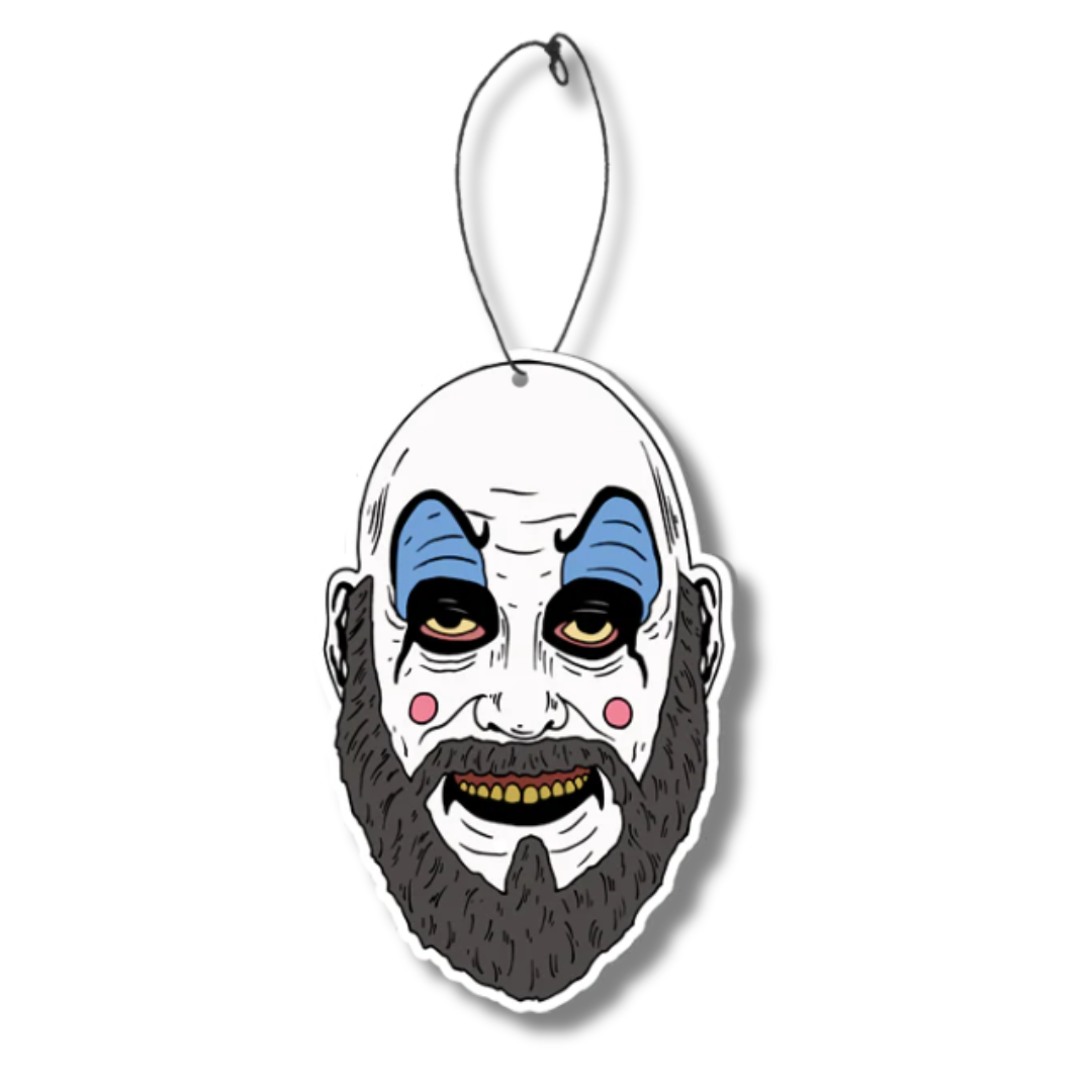 Officially licensed Captain Spaulding Fear Freshener from House of 1000 Corpses. Features vibrant, full-color artwork of Captain Spaulding with a sweet strawberry scent, measuring 3.5 inches tall. Includes an elastic band for easy hanging in cars, homes, or offices.